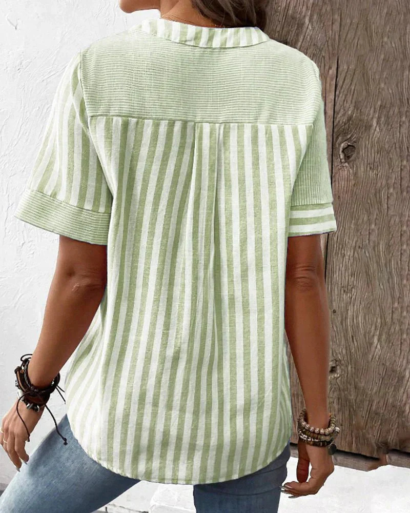 Women's striped colorblock blouse featuring a stylish half-button front, a must-have casual top.