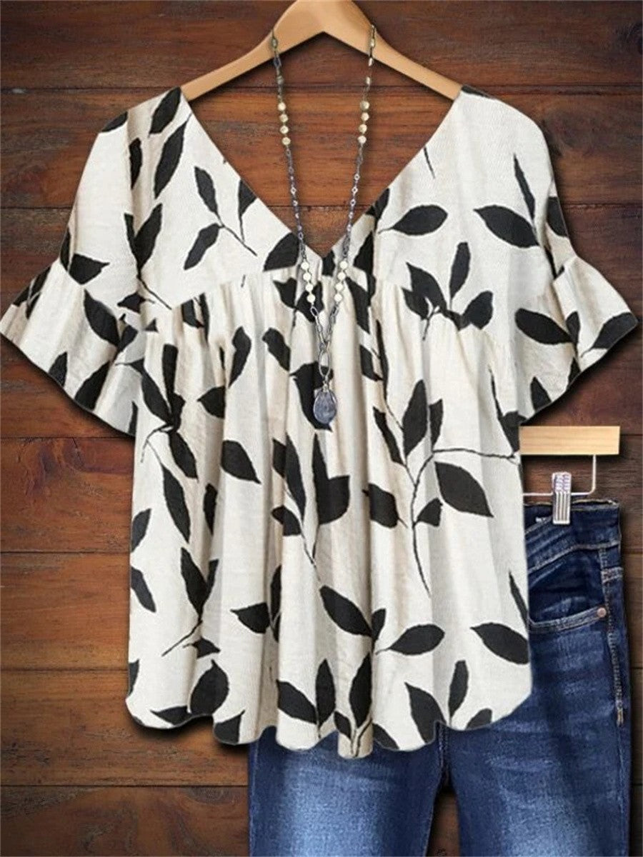 Women's white leaf print V-neck flutter sleeve blouse, a stylish and comfortable summer casual top.
