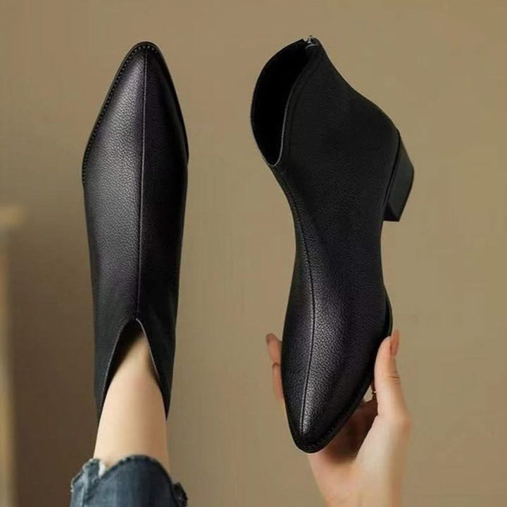 Women's chic low heel ankle boots with a sharp pointed toe, ideal for work or casual outings.