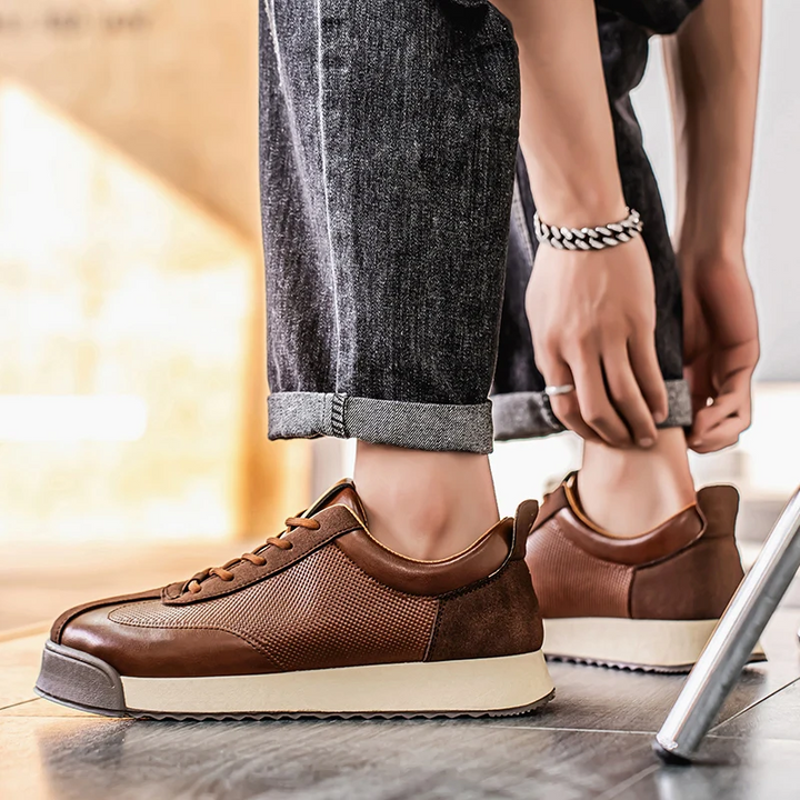 Comfortable brown men's urban sneakers, perfect for sleek casual outfits.