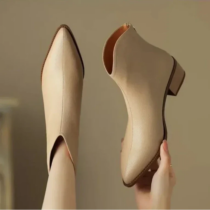 Sleek pointed toe ankle boots for women, combining fashionable design with practical low heel support.