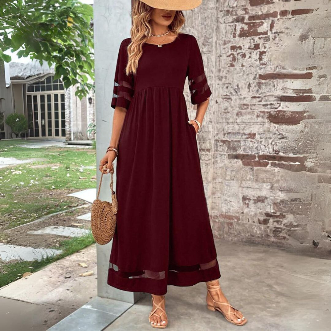 Women's Elegant Mesh Panel Gathered Maxi Dress. Features a round neck, 3/4 sleeves, and flowy silhouette.