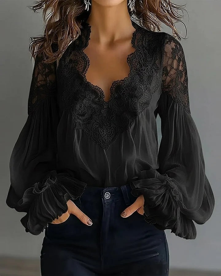Fashionable white V-neck blouse for women, with elegant puff and ruffle sleeves. Great for evening wear.