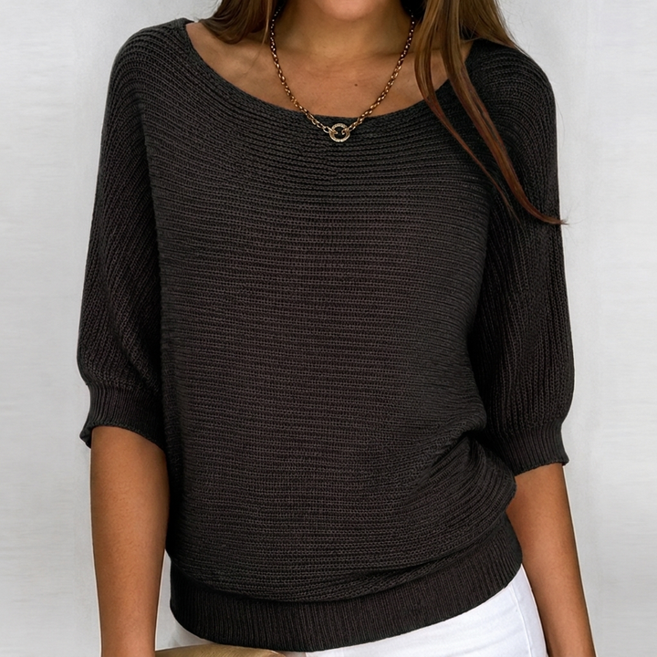 Oversized women's 3/4 sleeve knit sweater in a relaxed fit. Great for casual wear and transitional seasons.
