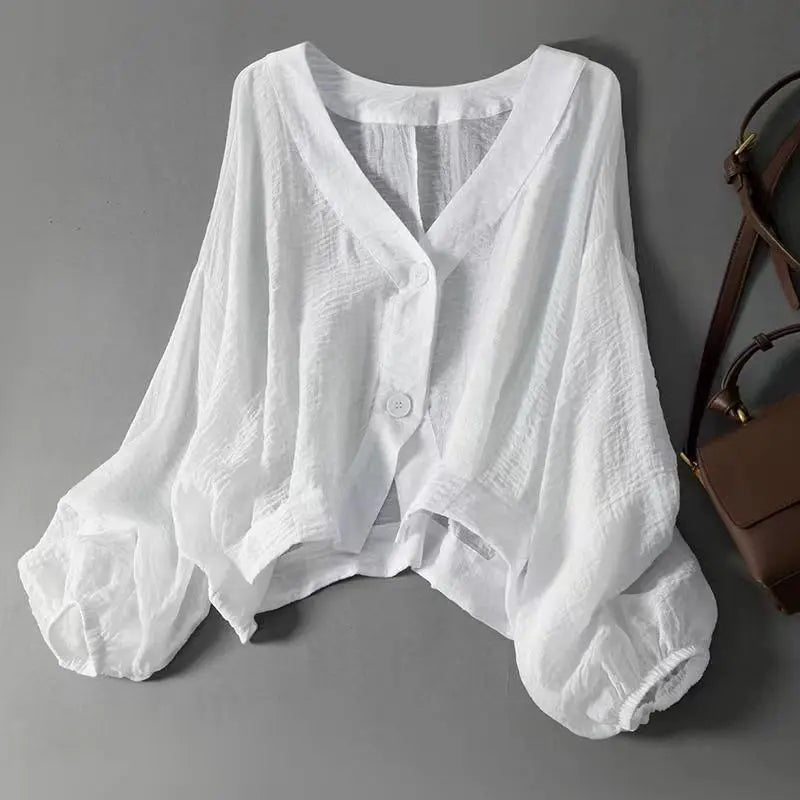 Women's flowy batwing sleeve summer blouse, elegant & chic for warm weather. Relaxed fit top.