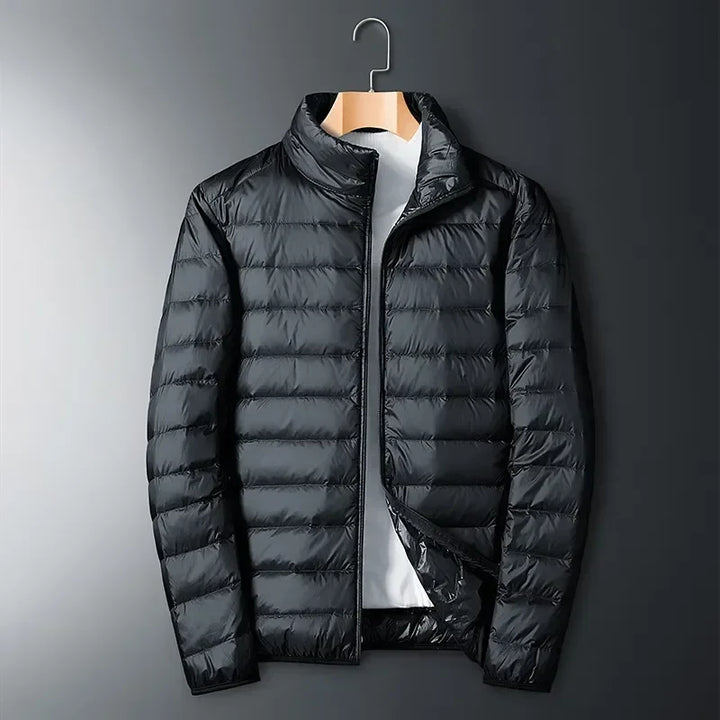 Person wearing a versatile lightweight packable puffer jacket for outdoor adventures, travel & cold weather protection.