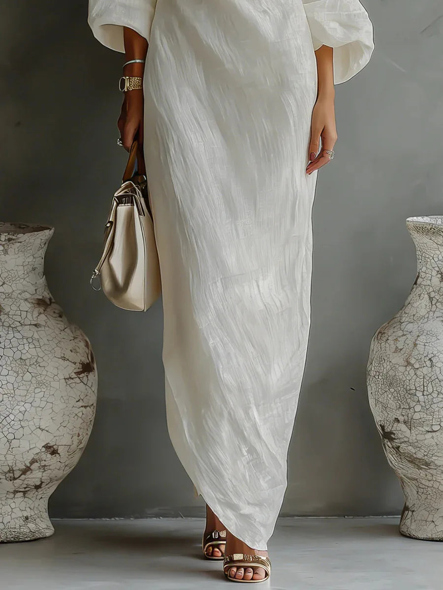 Black women's one shoulder asymmetrical party dress. Elegant design with a relaxed batwing sleeve and side pocket.