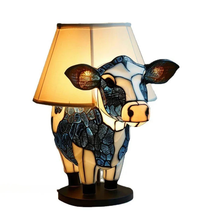 Brighten your space with a unique stained glass look animal accent lamp, a charming resin fixture.