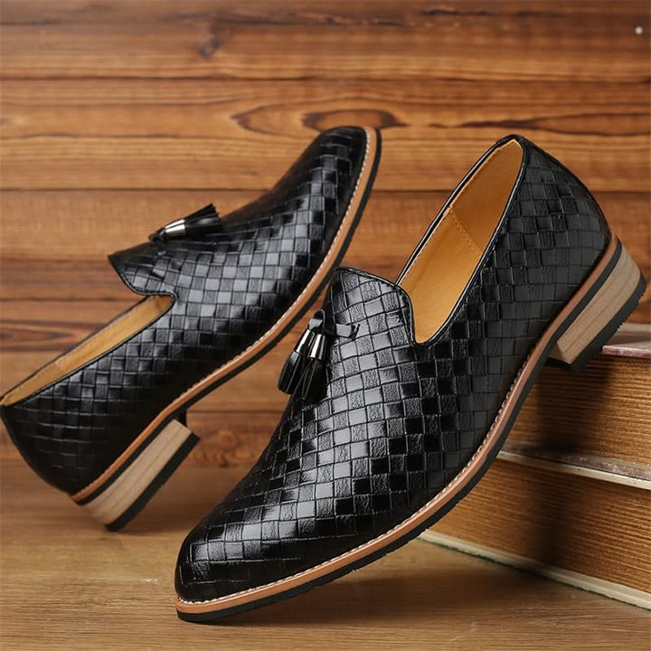 Stylish men's dress loafers with intricate woven texture and classic tassels. Durable men's fashion.