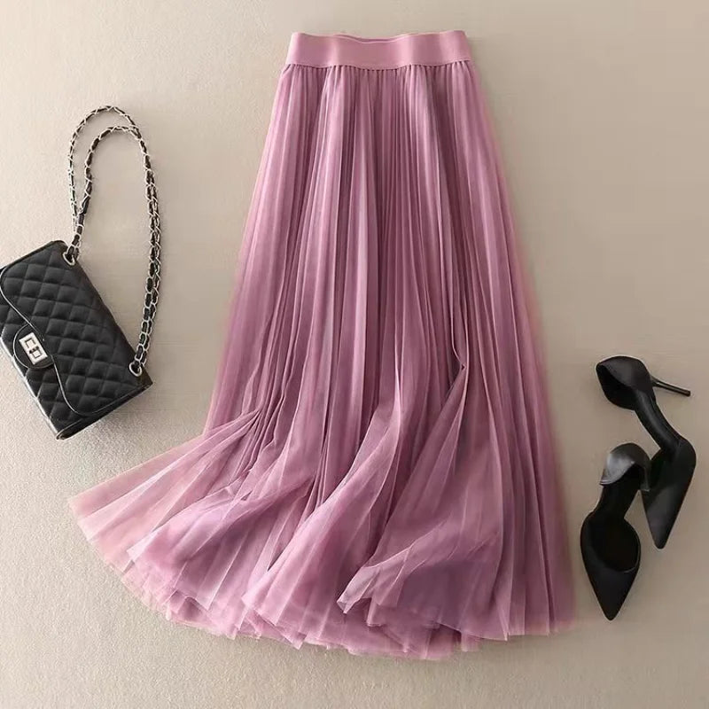 Chic women's high-waist pleated A-line midi skirt, flowy silhouette, ideal for elegant or casual spring/summer styles.