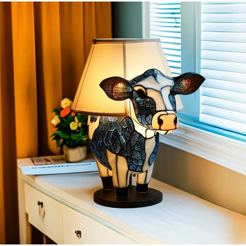 Decorative animal table lamp, featuring a stunning stained glass look, adds colorful light to any room.
