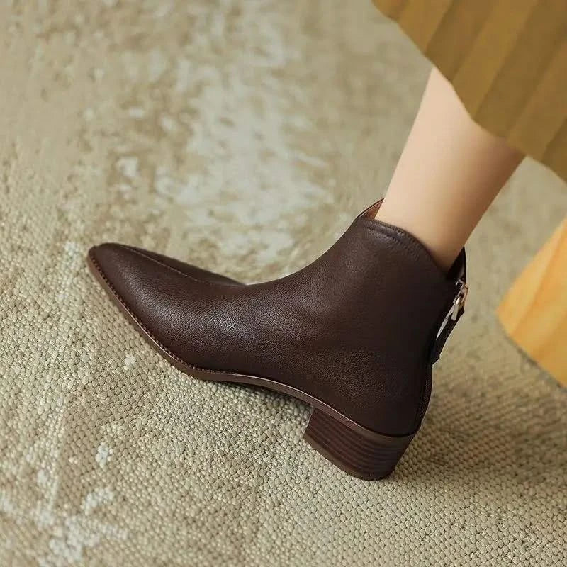 Chic women's pointed toe ankle boots, comfortable slip-on design, versatile for any outfit.