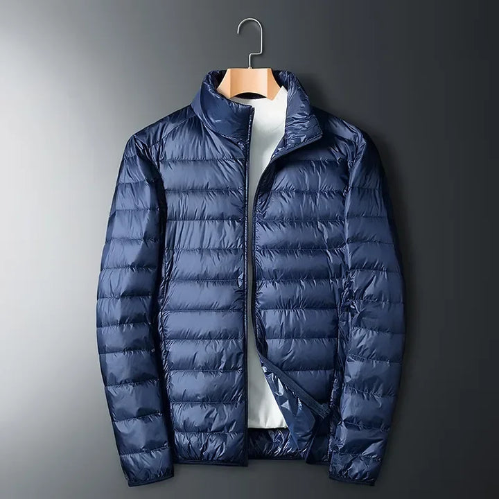 Durable & waterproof unisex puffer jacket. Lightweight, warm & packable for cold weather outdoor adventures & travel.