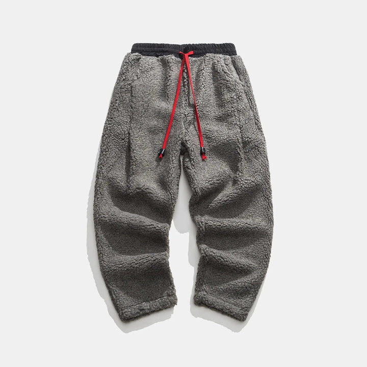 Men's relaxed fit sherpa joggers with adjustable drawstring waist, offering cozy comfort & stylish casual wear.