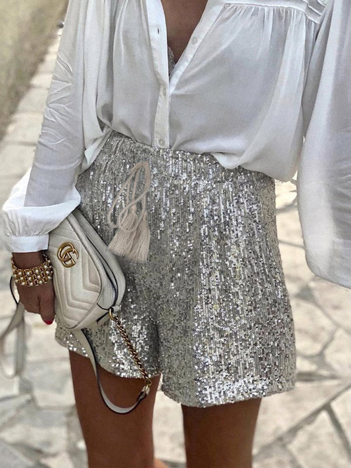 Fashion-forward women's sequin shorts in shimmering silver, great for party wear & trendy outfits.
