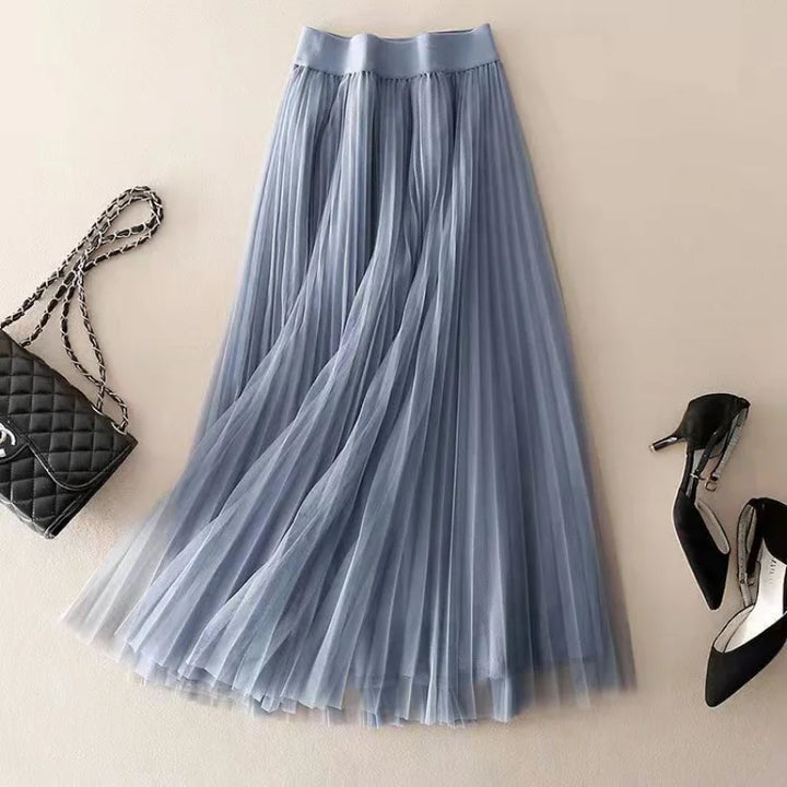 Beautiful women's pleated A-line flowy midi skirt, high-waisted design, perfect for a graceful spring/summer look.