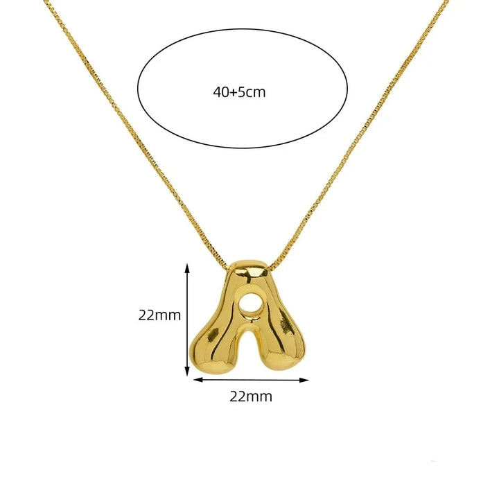 Dainty gold-tone initial letter pendant necklace for women. Personalized statement jewelry & everyday accessory.