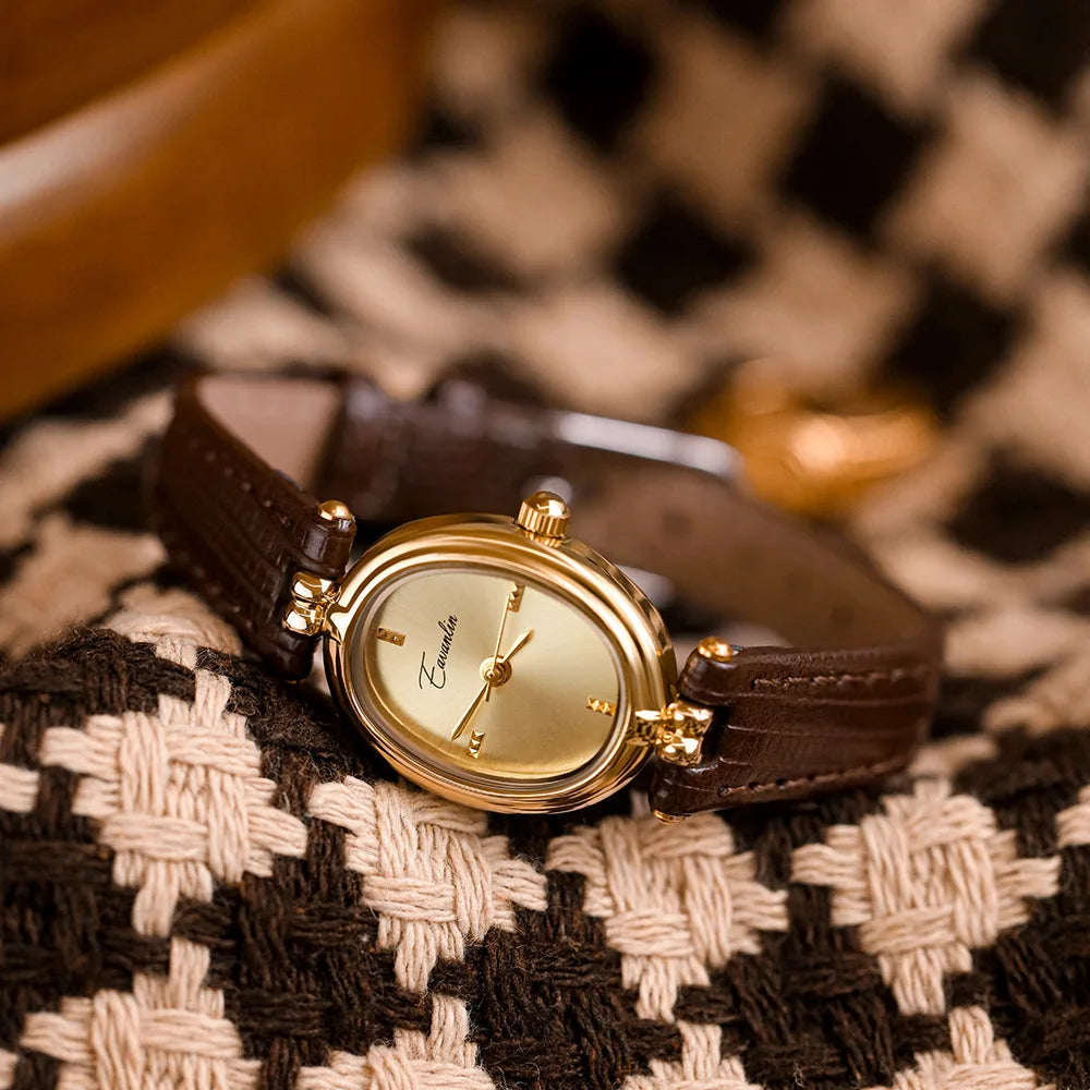 Close-up of an elegant slim women's wristwatch, highlighting its sophisticated and modern design.