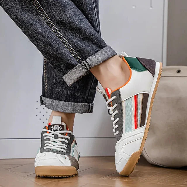 Dark-toned men's utility sneakers, blending modern style with durable construction for everyday wear.