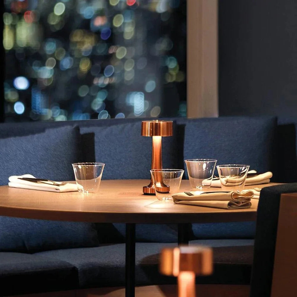 Modern LED table lamp, touch sensor control, provides warm ambient light for any room.