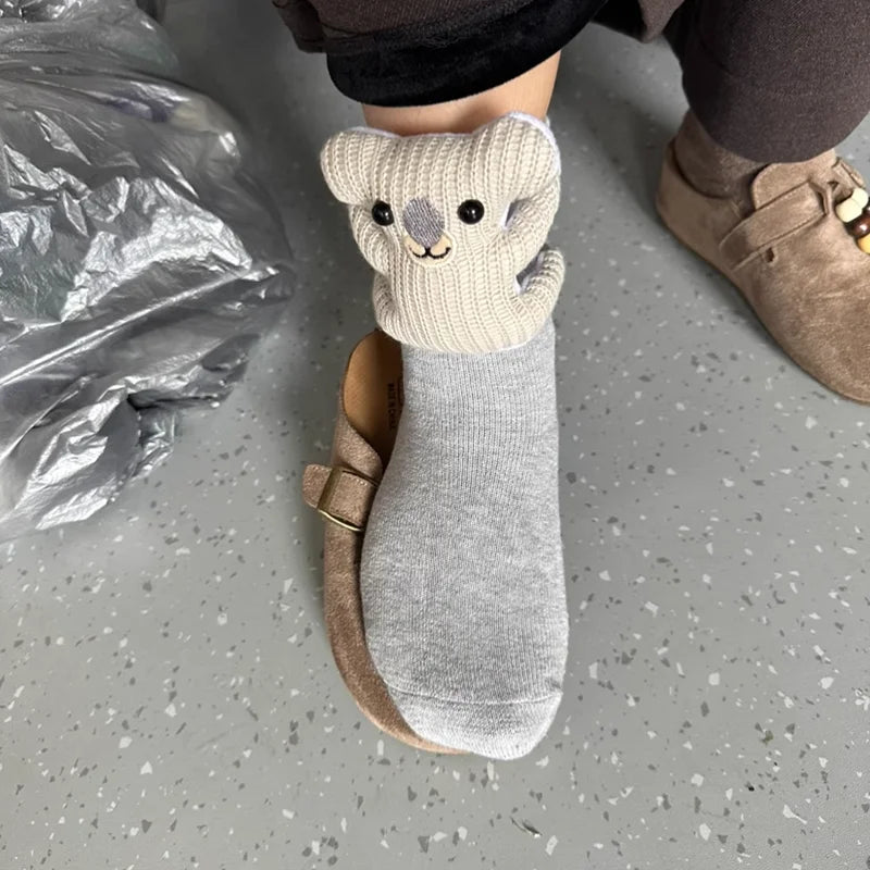 Soft, fluffy animal house socks with a non-slip sole, providing cozy comfort for all adults at home.