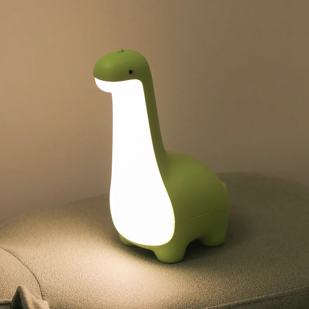 Rechargeable soft silicone dinosaur bedside lamp, perfect for children's nurseries with a gentle light.
