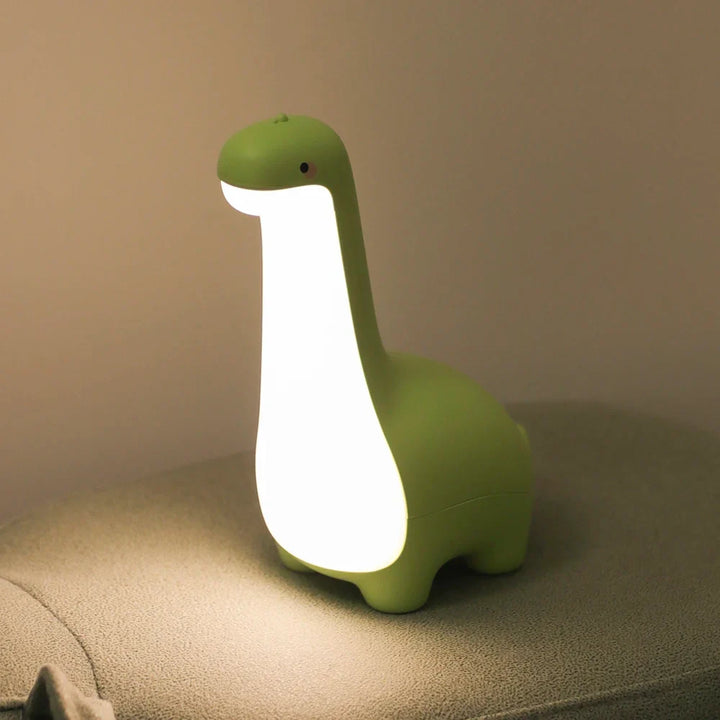 Rechargeable soft silicone dinosaur bedside lamp, perfect for children's nurseries with a gentle light.