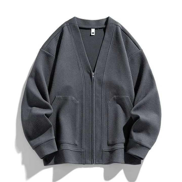 Gray men's full zip sweater with practical pockets, relaxed fit for ultimate comfort. Stylish casual outerwear.