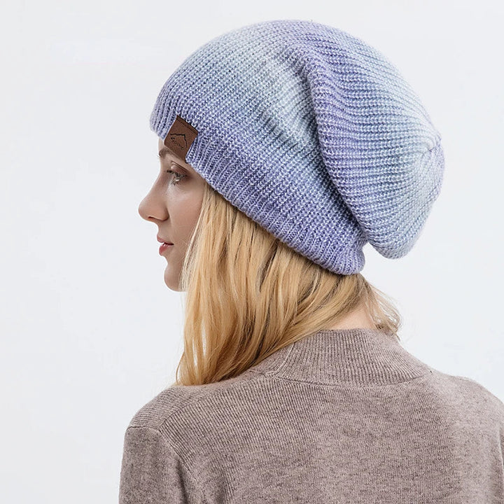 Stylish unisex rainbow knit beanie, perfect for adding a colorful touch to your winter outfit.
