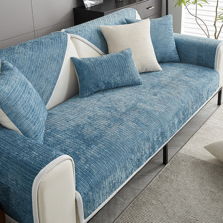 Stylish waterproof sofa cover in modern blue, enhancing living room decor while protecting furniture from spills.