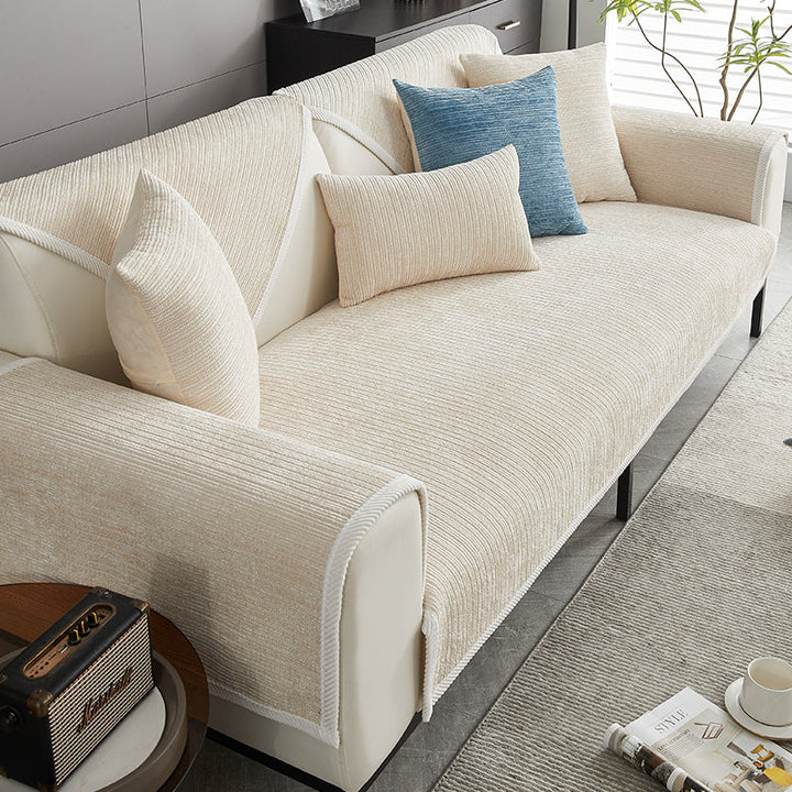 Pet friendly couch protector in grey, offering waterproof, non-slip coverage for sofas. Easy care furniture guard.