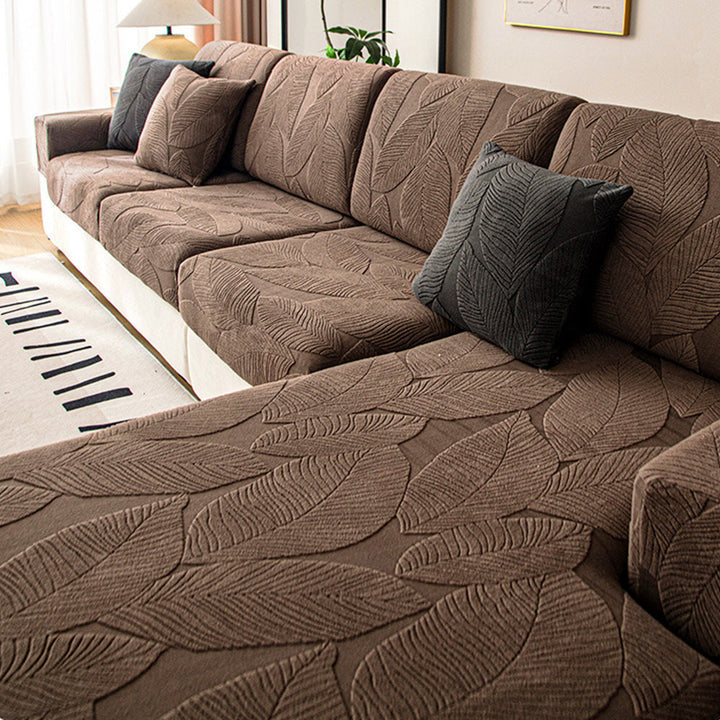 Anti-scratch & water-repellent sofa slipcover for living rooms. Modern leaf jacquard design, pet-friendly.