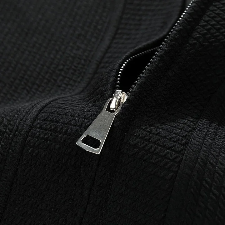 Men's casual zip-up sweater with pockets, relaxed fit for comfort and easy layering. Essential men's outerwear.