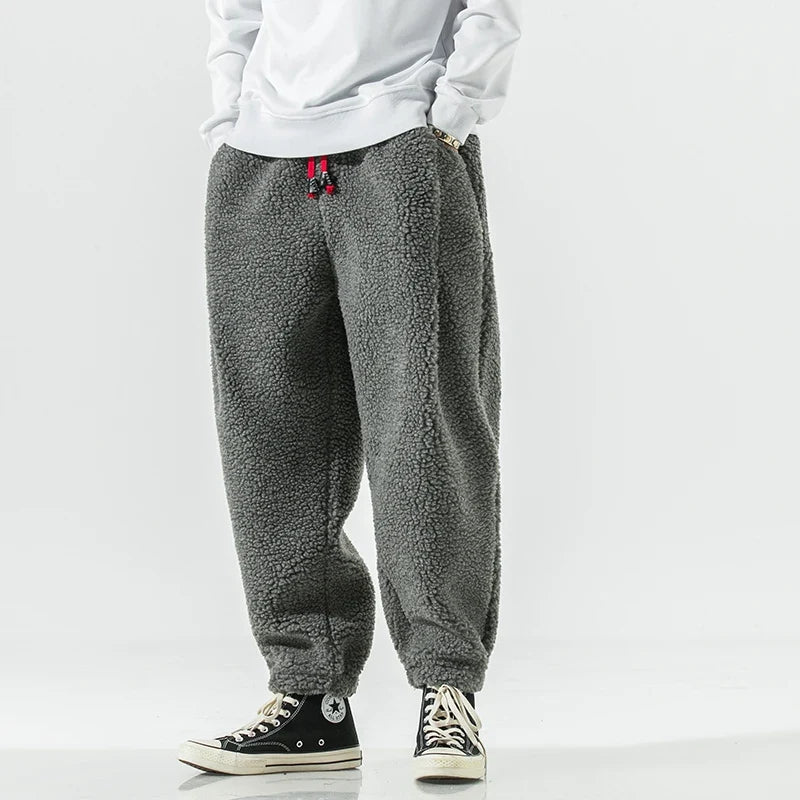 Ultimate comfort men's sherpa joggers, designed for warmth & relaxation. Essential cozy pants for casual style.