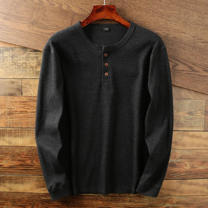 Detailed shot of soft, textured waffle knit. Men's comfortable casual long sleeve shirt.