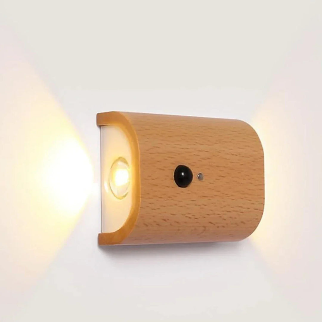 Smart rechargeable motion sensor wall light with warm white LED, magnetic mount, & elegant wooden finish for hallway.