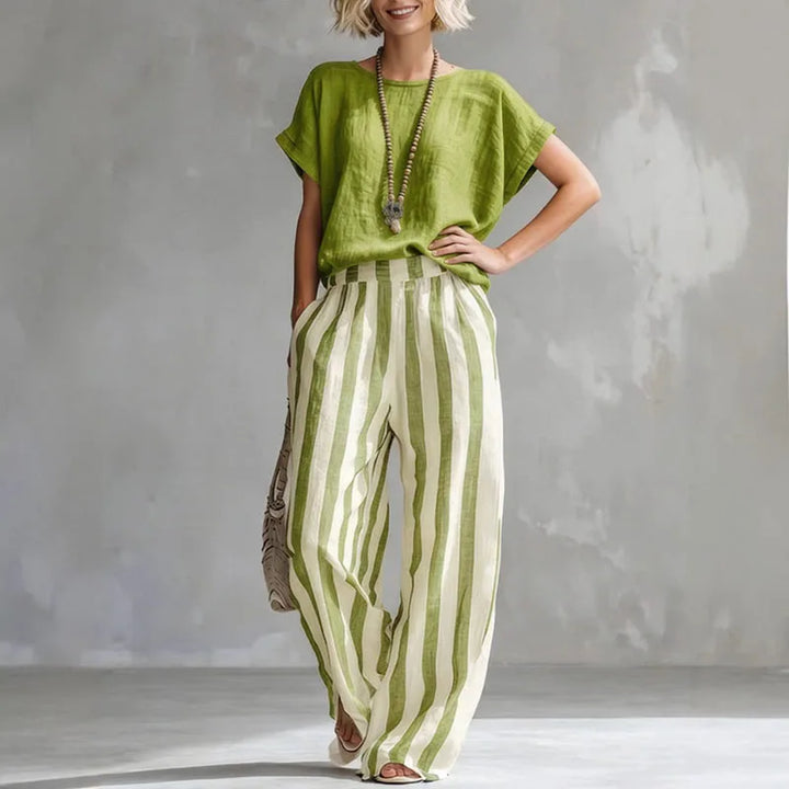 Relaxed women's linen summer set including a comfortable top and wide-leg pants. Stylish two-piece casual outfit.