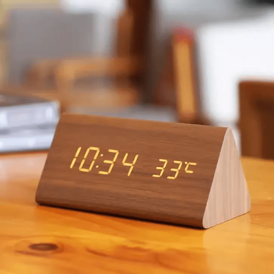 Elegant wooden LED alarm clock with modern digital display & voice command.
