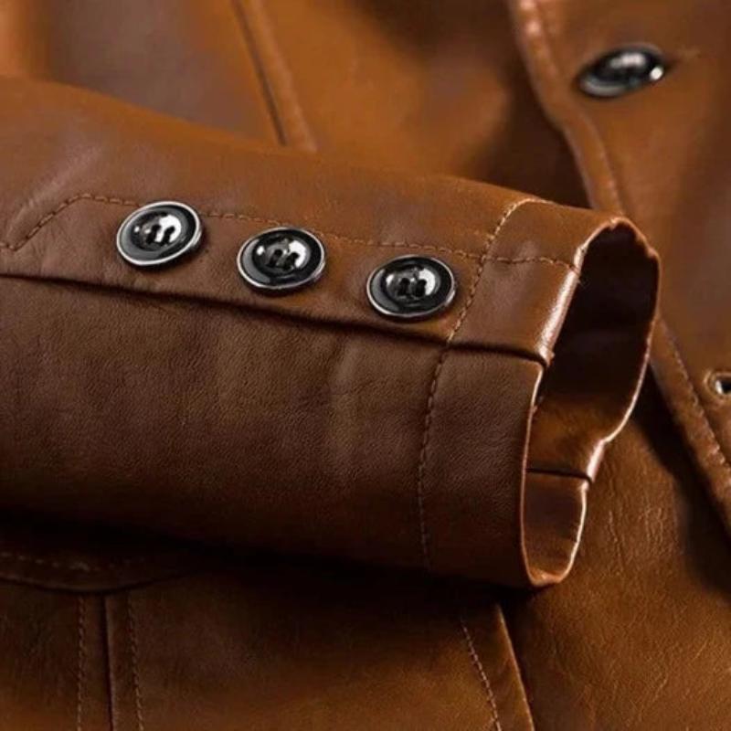 Close-up detail of men's tailored jacket, showcasing buttons, pockets, and fabric texture on a versatile outer layer.