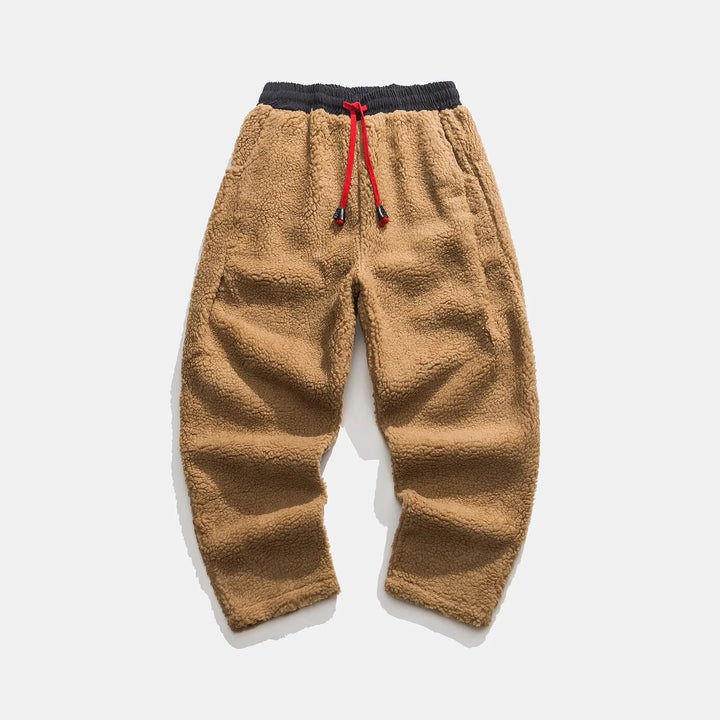 Comfortable men's sherpa sweatpants, ideal for lounging or casual wear. Soft, warm drawstring joggers for men.