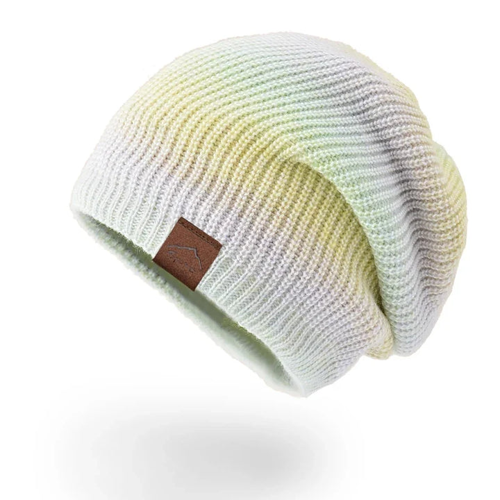 Soft rainbow knit beanie, ideal for staying warm and making a statement this winter.
