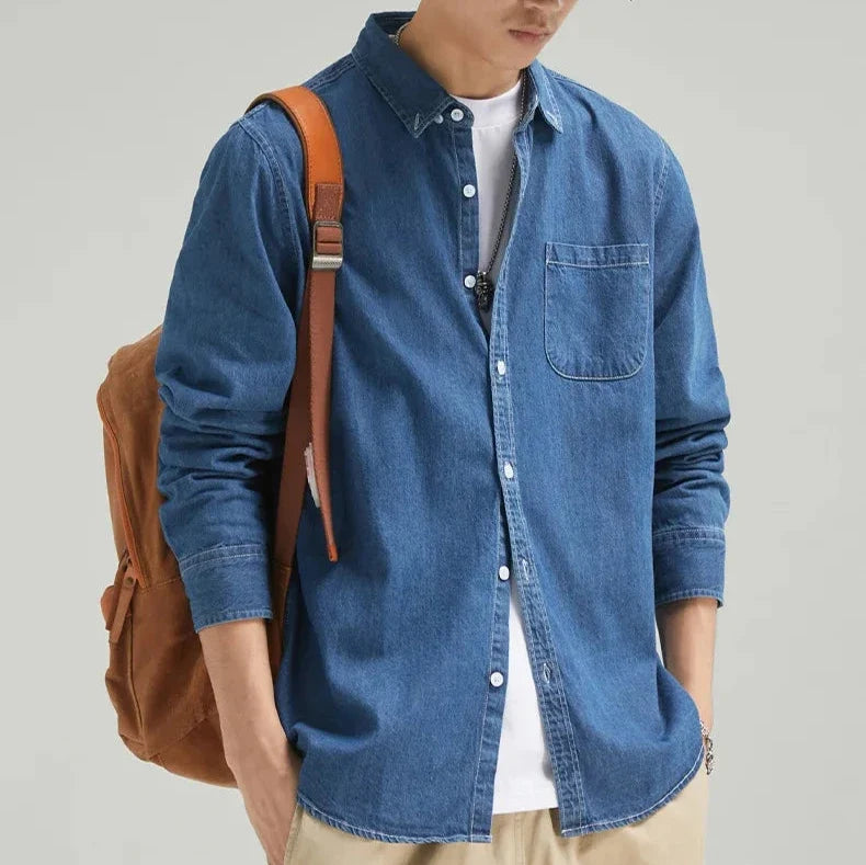 Effortless men's classic denim long-sleeve shirt. Button-down, casual, versatile for any day.