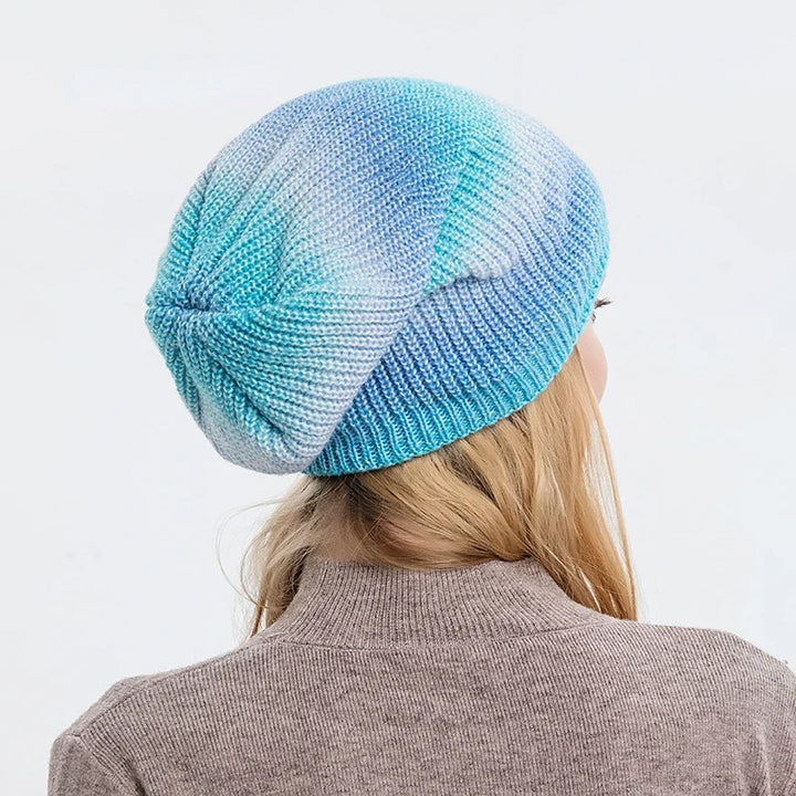 Warm & cozy rainbow knit beanie, a vibrant fashion accessory for cold weather.