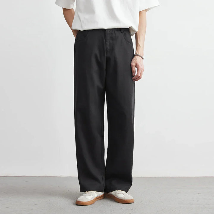 Black men's wide leg utility pants with a relaxed fit, perfect for comfortable everyday wear.