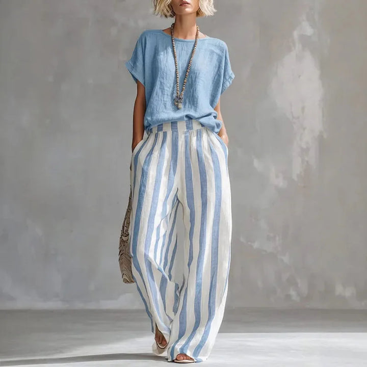 Breathable women's linen summer set. Relaxed two-piece outfit with comfortable wide-leg pants for warm weather.