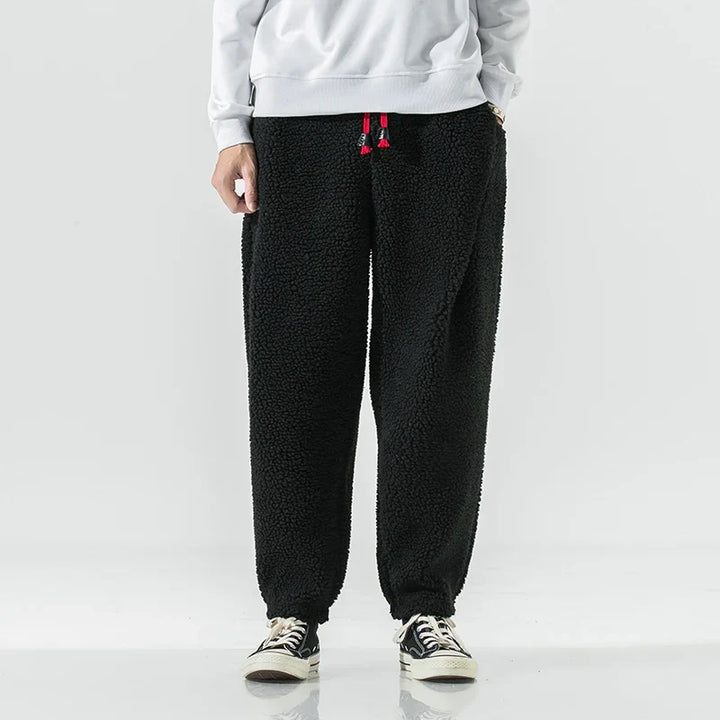 Man wearing comfortable men's sherpa joggers, perfect for a relaxed fit and cozy loungewear. Casual & stylish.