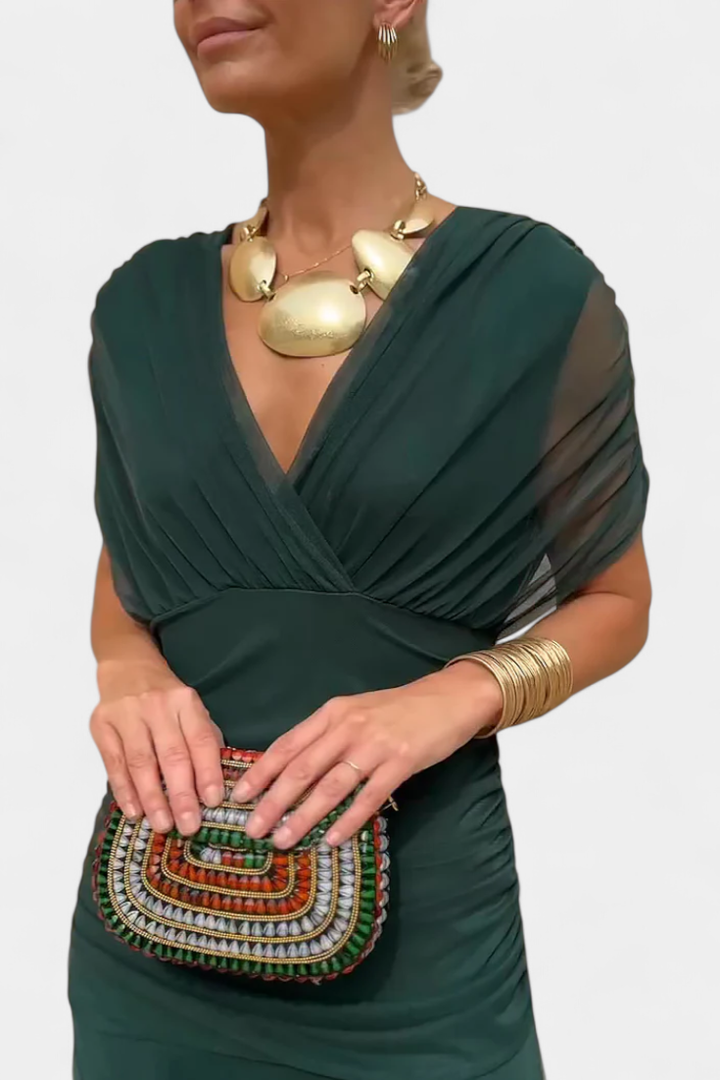 Women's midi dress: off-shoulder, ruched bodice, and chic twist-front detail for parties.
