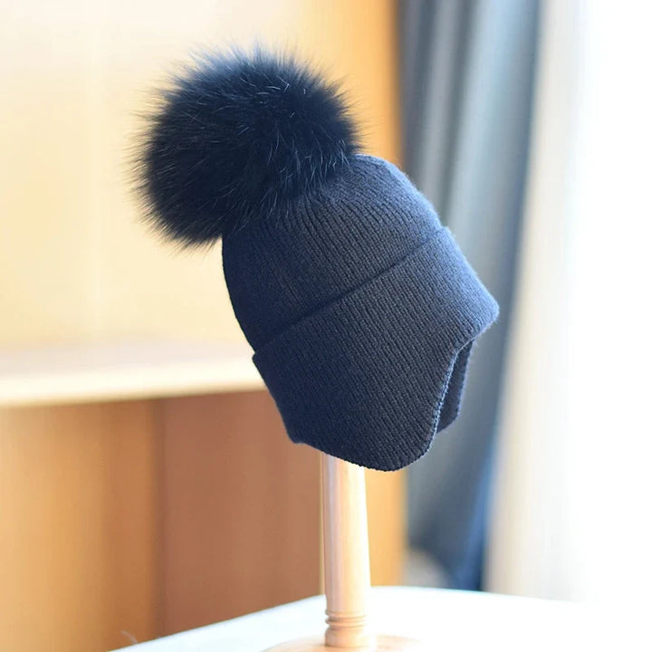 Stylish winter pom beanie hat for men & women. Provides ultimate warmth & comfort in cold weather. Apparel accessory.