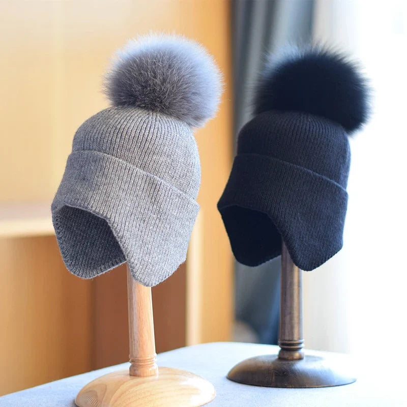 Unisex warm pom beanie. Cozy knit hat perfect for winter adventures & cold weather. Stylish apparel accessory.