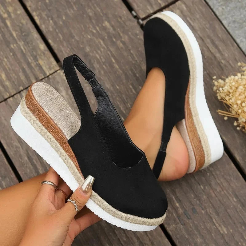 Close-up of women's orthopedic sandals, showcasing posture support & comfortable design. Ideal for foot health.